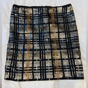 Marc Cain Elegant Black and Gold Sequin Skirt. Back zipper, size 12.